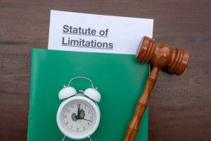 Clock, gavel, and document labeled ‘Statute of Limitations’ symbolizing the legal deadline for filing Pennsylvania car accident injury claims.